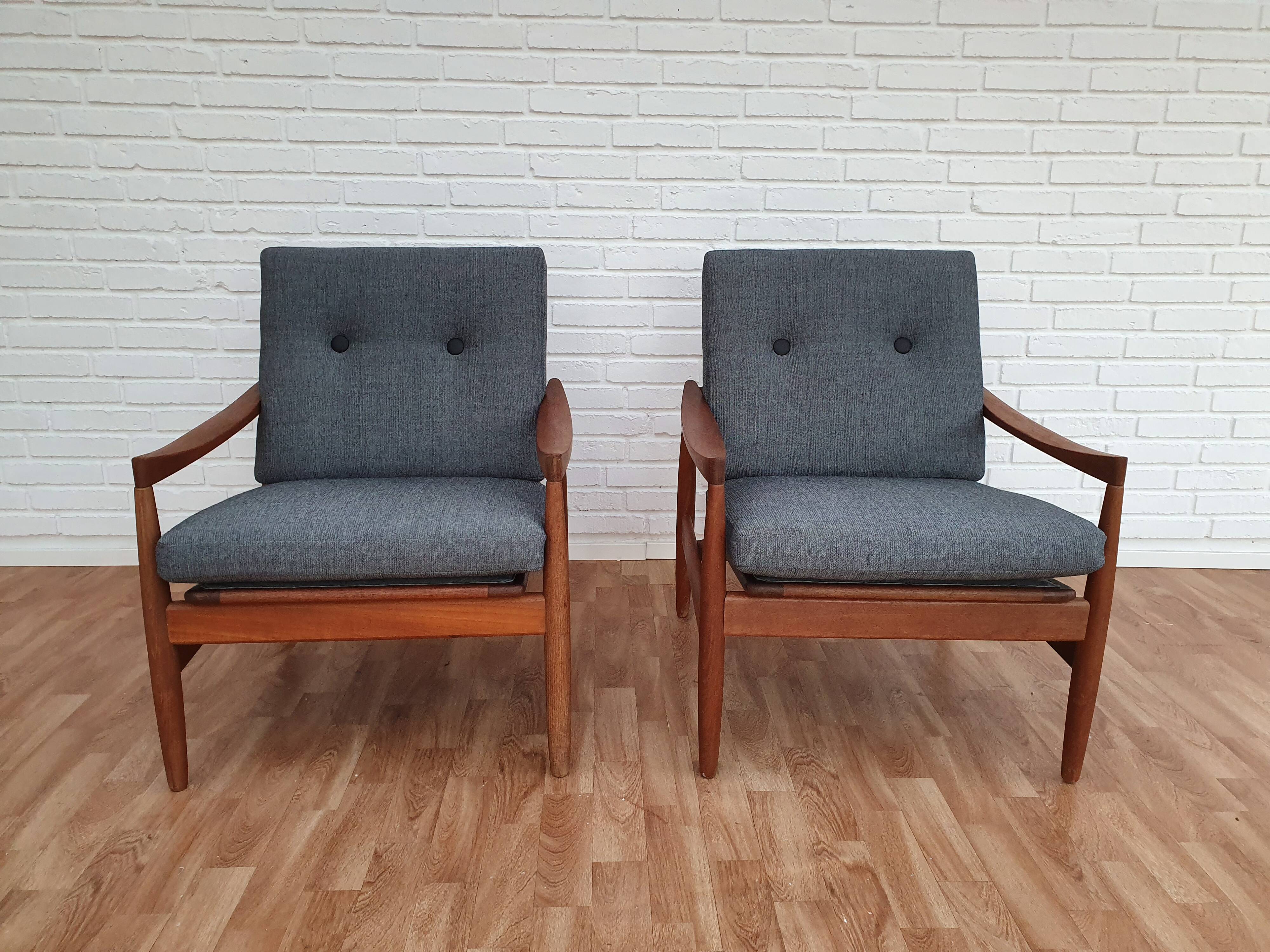 A pair of Danish armchairs, teak, wool, leather