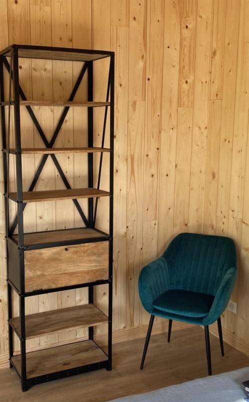 Industrial shelf made of solid exotic mango wood with riveted metal.