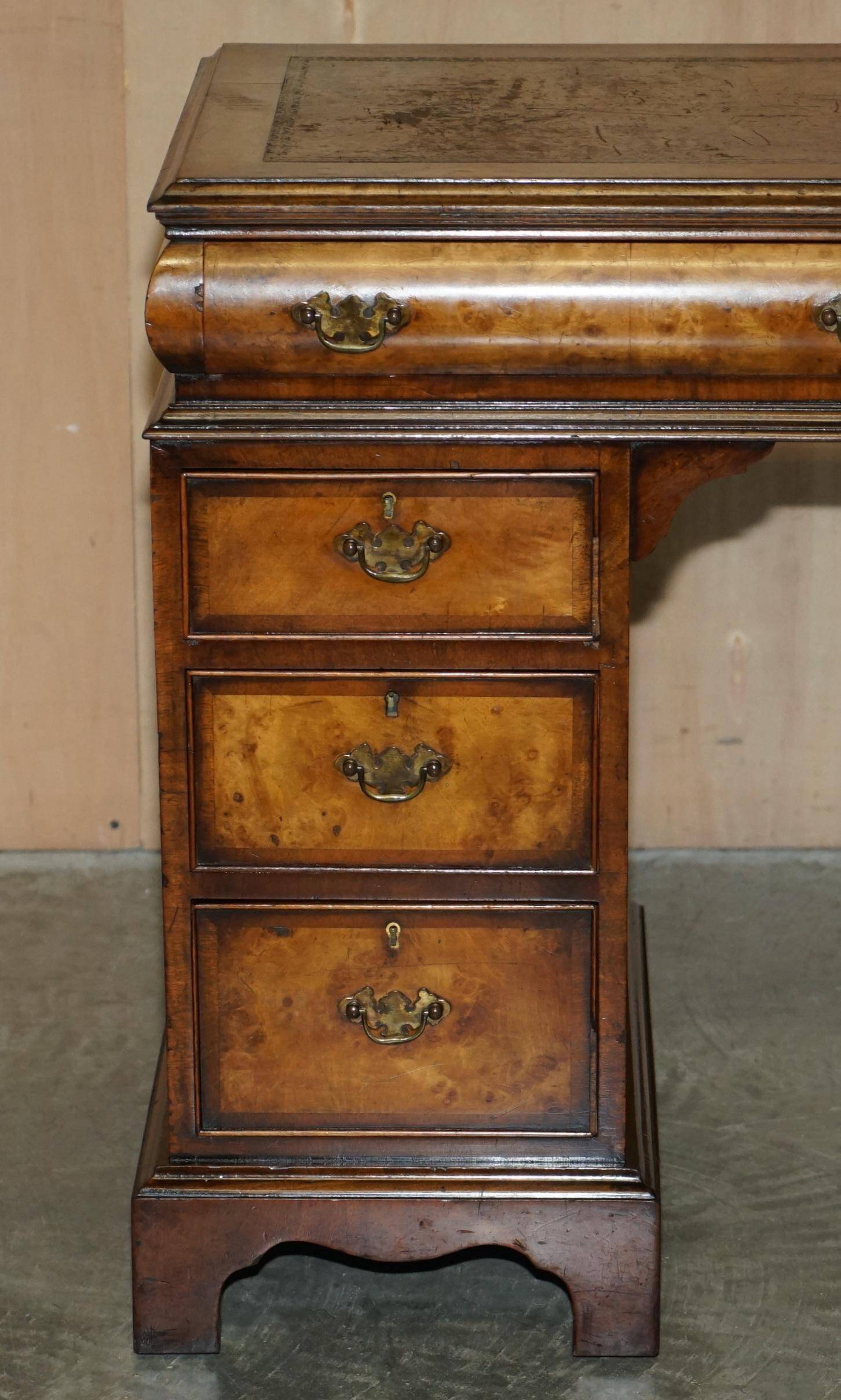 Victorian antique partner's desk in veined walnut with a leather top.