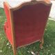 Louis XV style carved wooden shepherdess chair. Red velvet