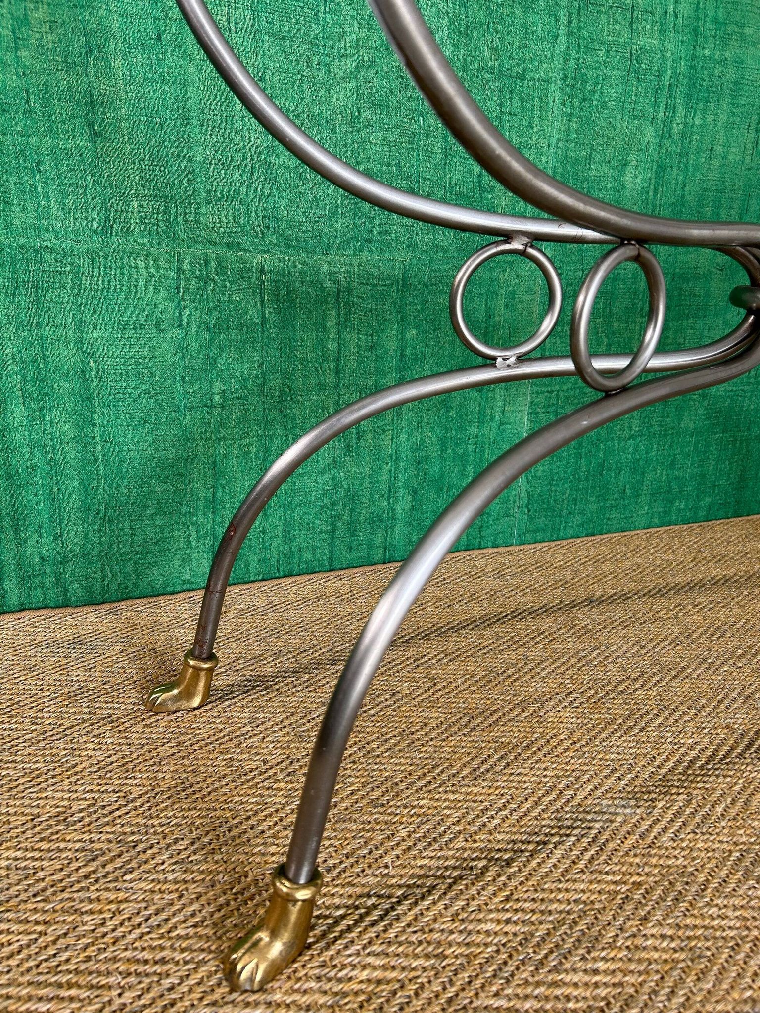 Polished steel and brass console, probably Maison Jansen, France, mid-century modern Hollywood Regency.