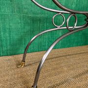 Polished steel and brass console, probably Maison Jansen, France, mid-century modern Hollywood Regency.