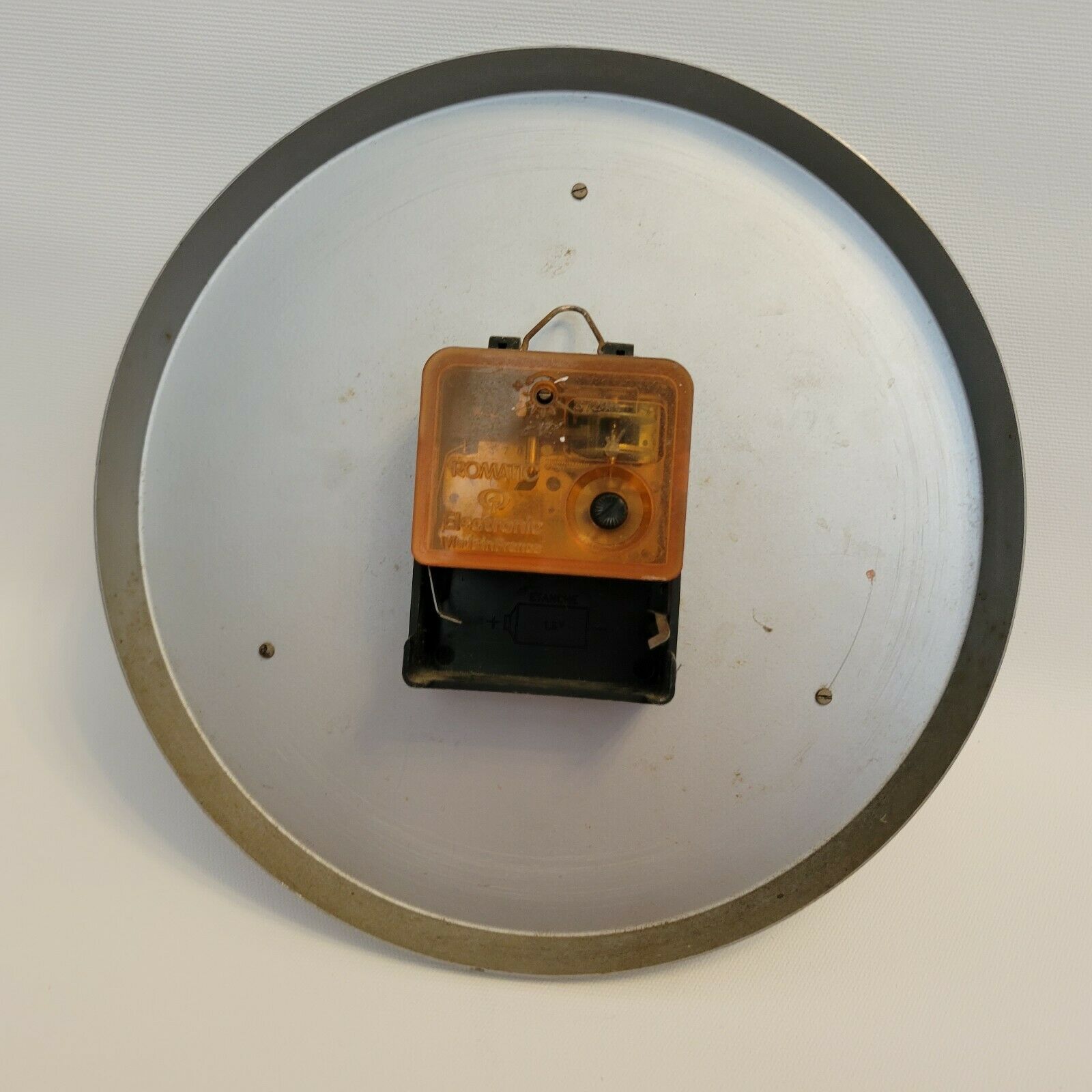 Old orange aluminum clock Manufrance Saint-Etienne