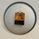 Old orange aluminum clock Manufrance Saint-Etienne