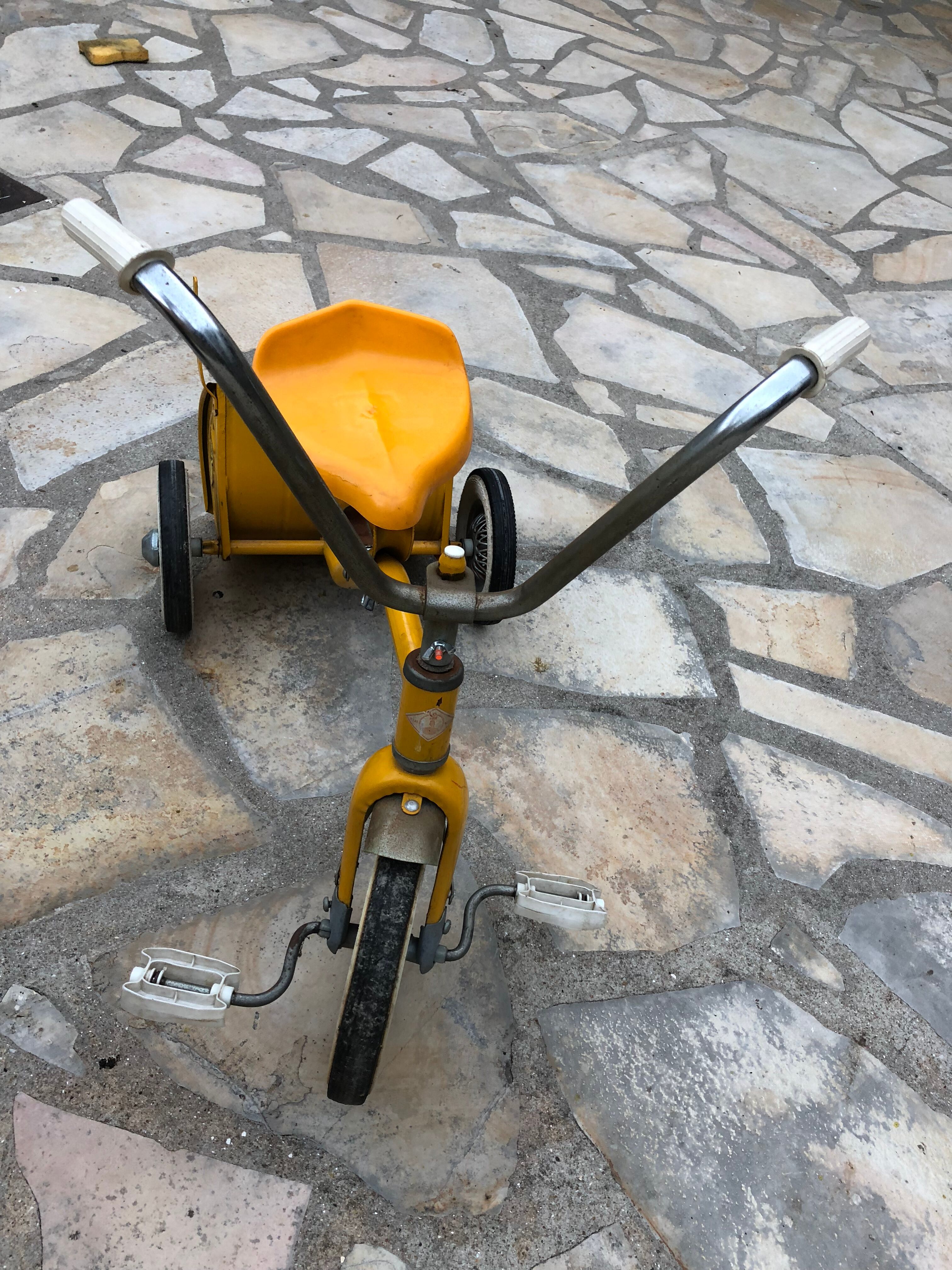 Yellow tricycle with folding bucket