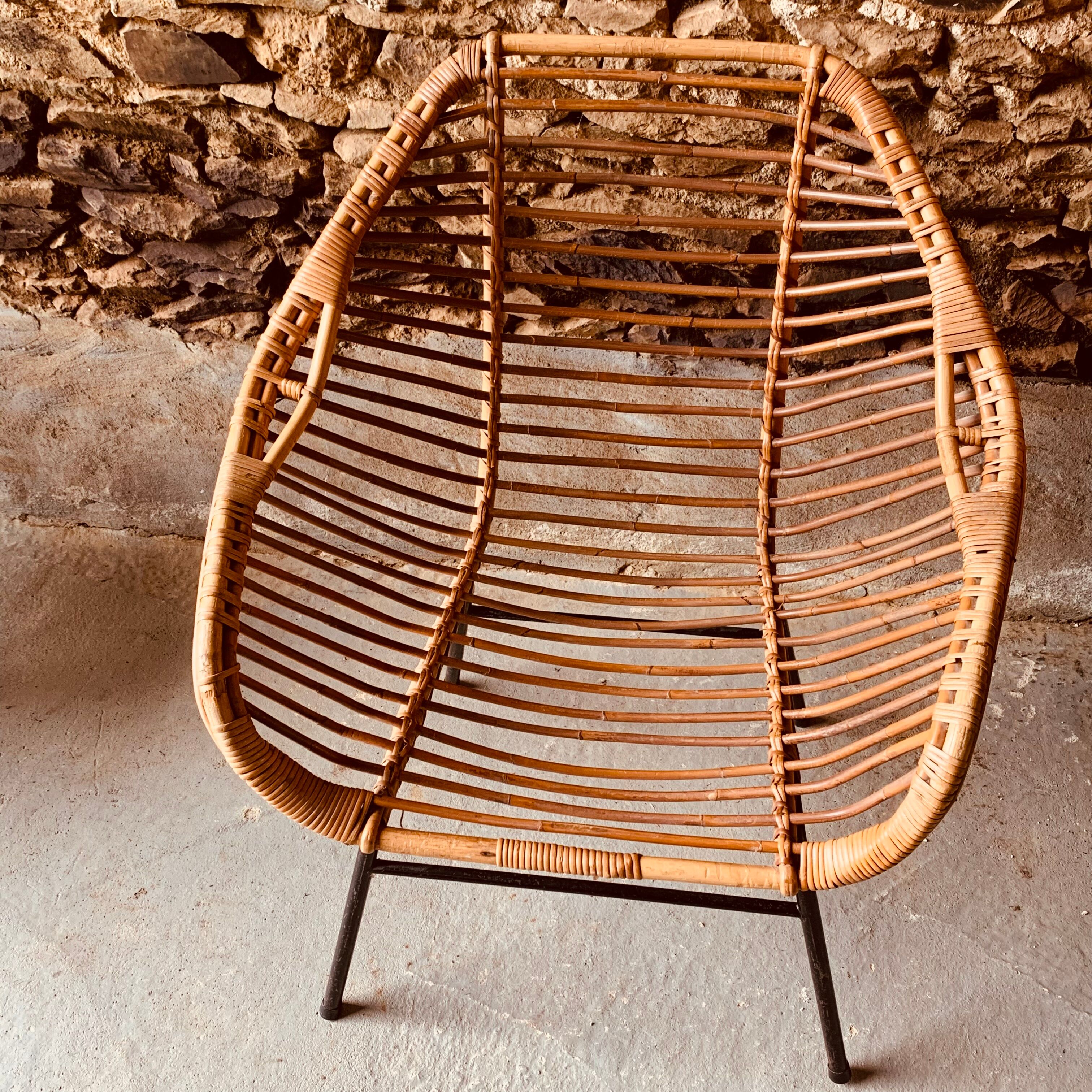 Rattan armchair and black metal base 1960