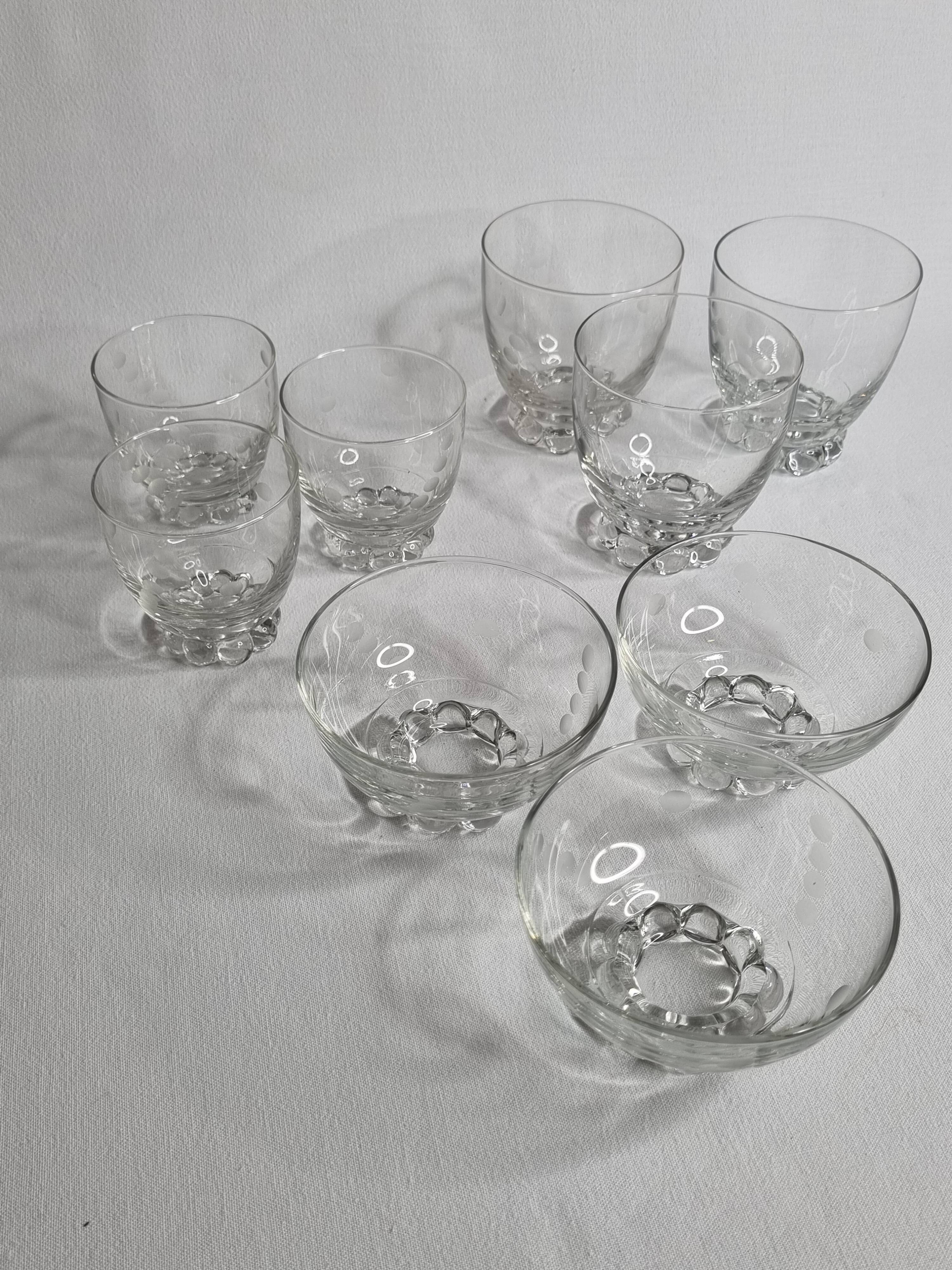 Set of Art Deco style engraved crystal bowls and glasses on spherical feet