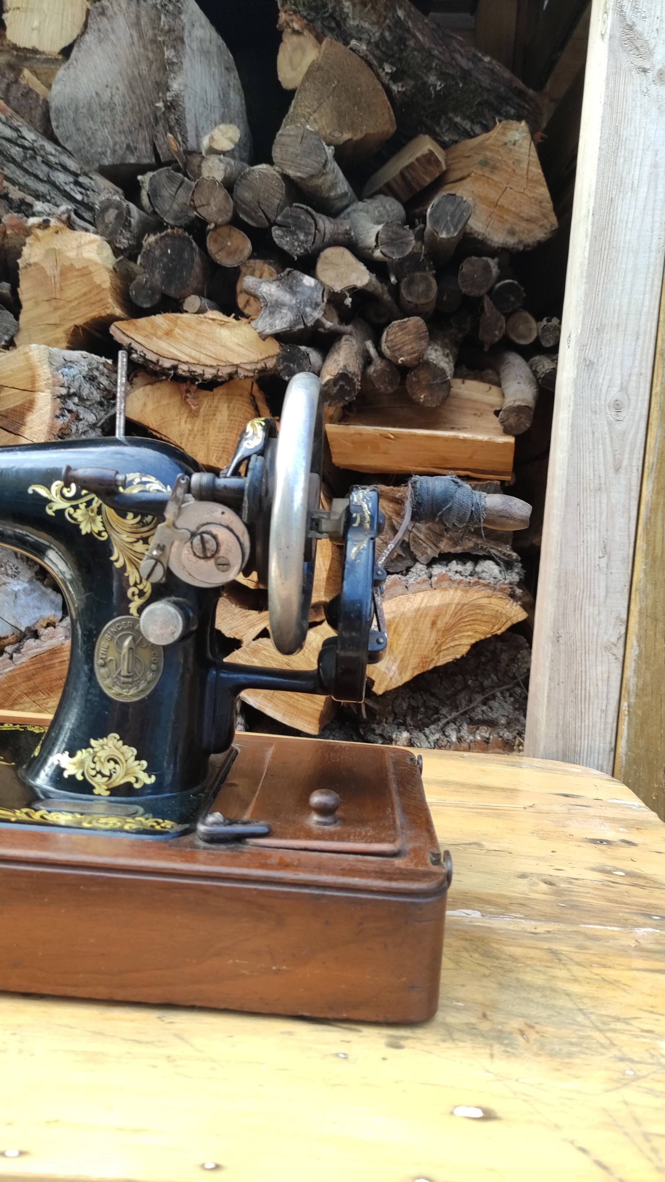 Old Singer sewing machine on its original base