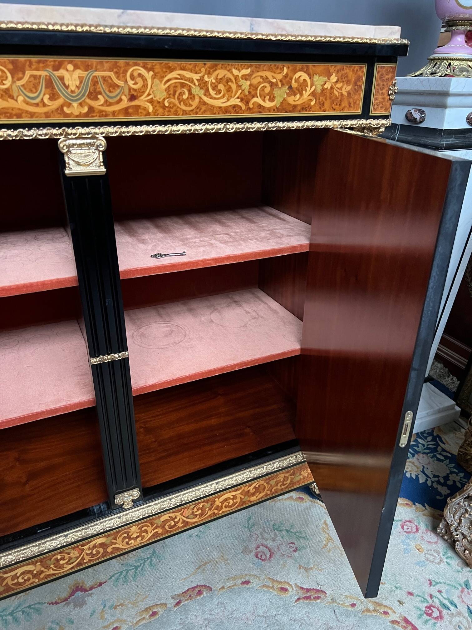 Two-door commode in Louis XVI style with marquetry and marble top.