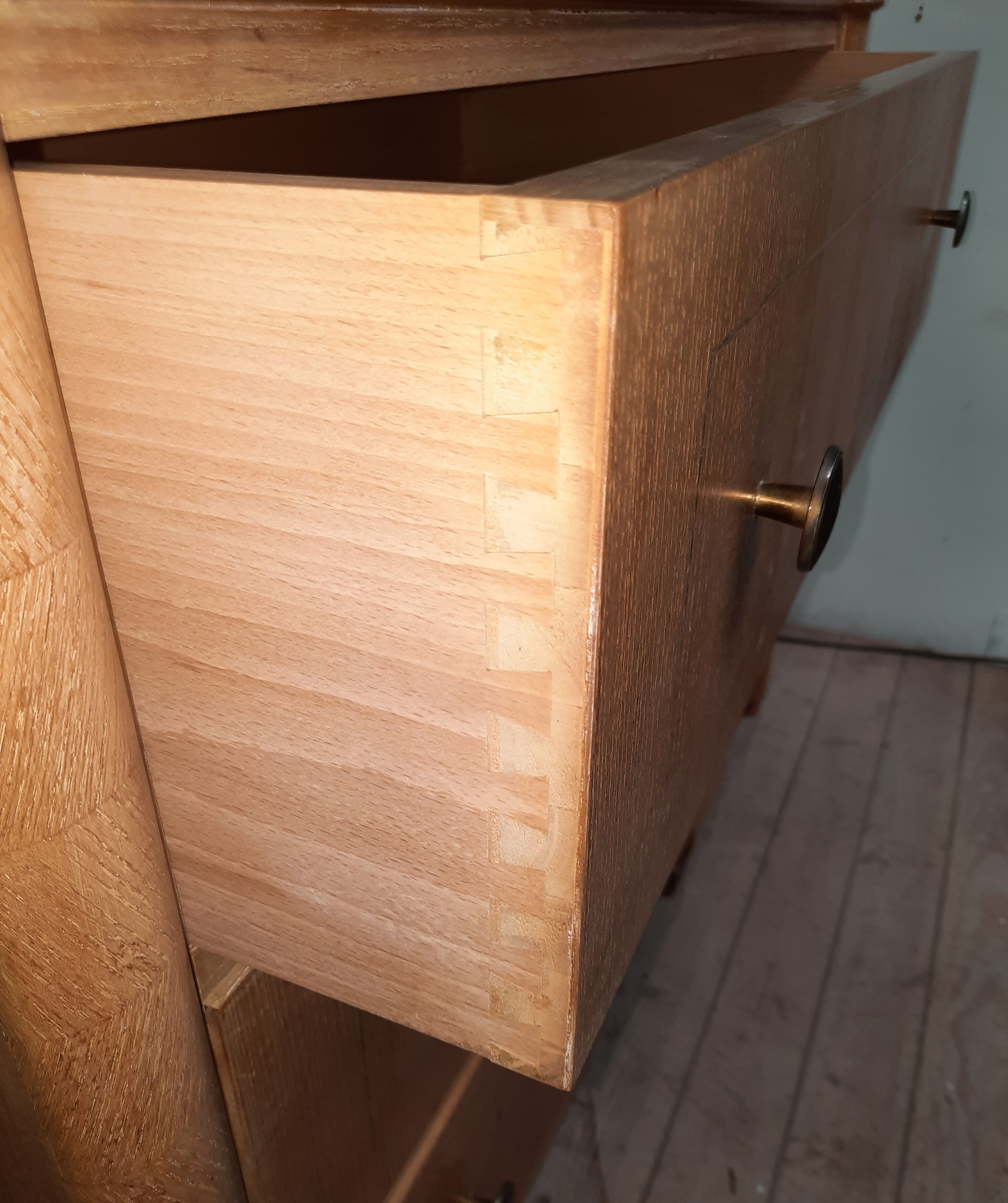 Vintage wooden chest of drawers with clear veneer