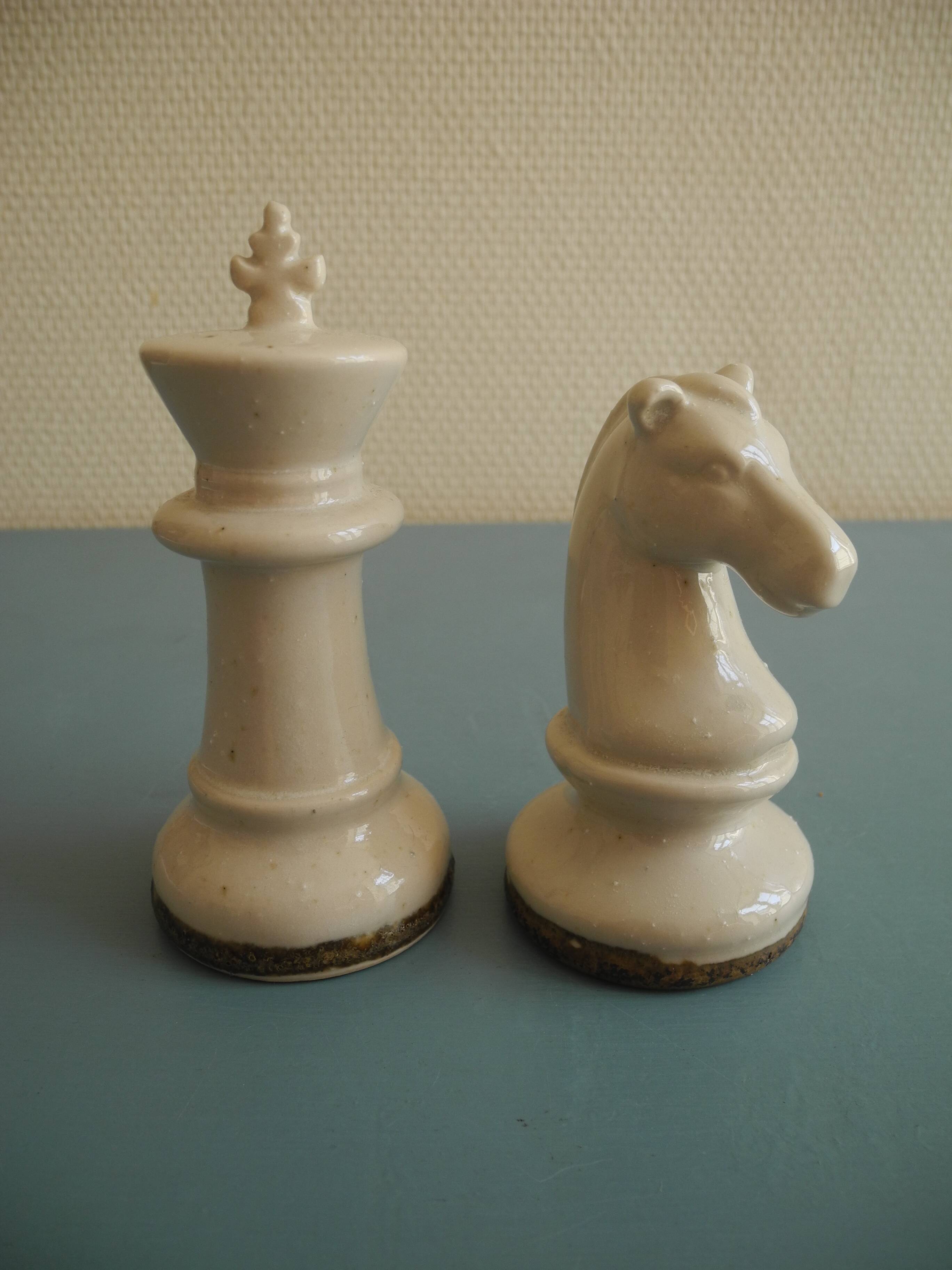two ceramic chess pieces decorative