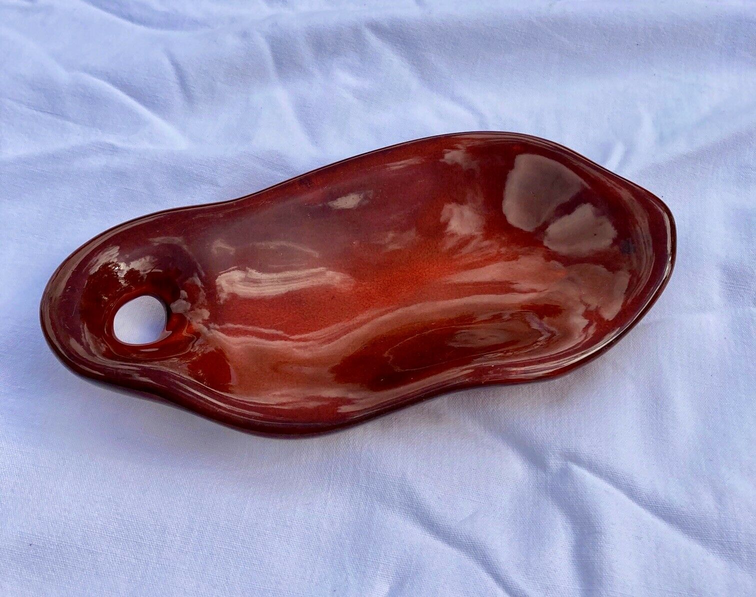 Enamelled ceramic flat monogram of Max Idlas on the back