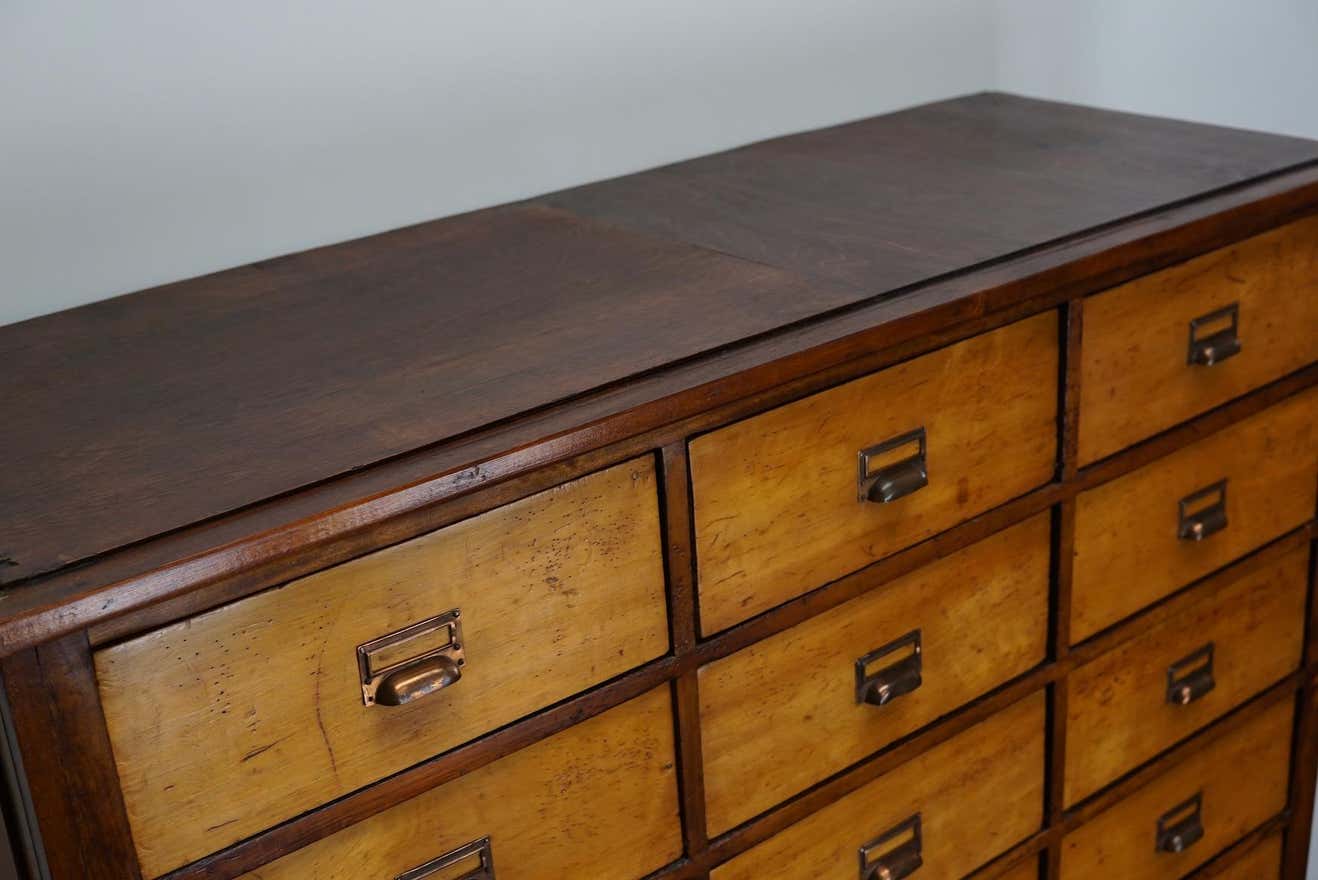 School cabinet bank of vintage Dutch drawers in mid-twentieth century pine
