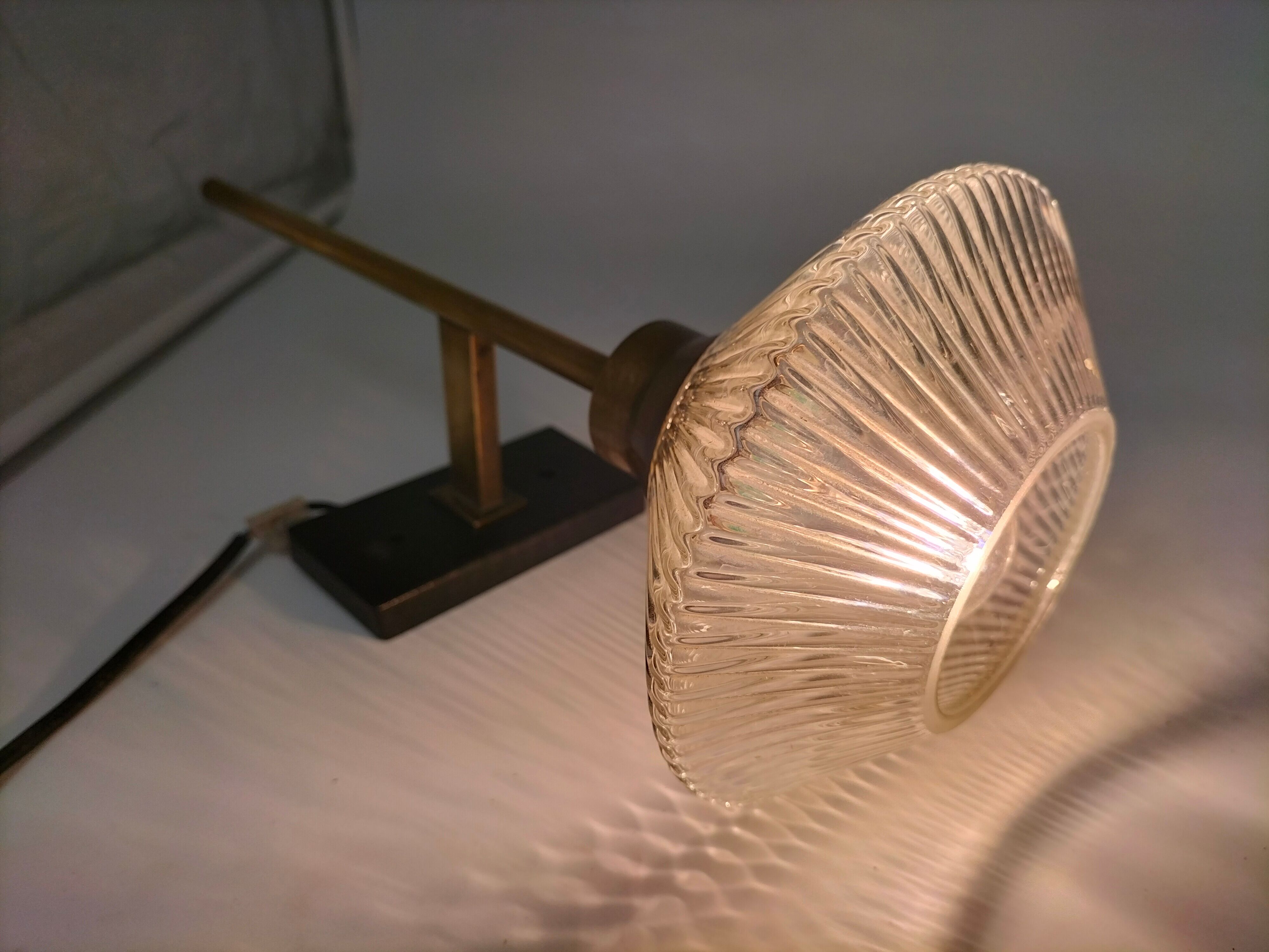 Pair of brass and glass wall lamps