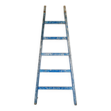 Old ladder in blue wood