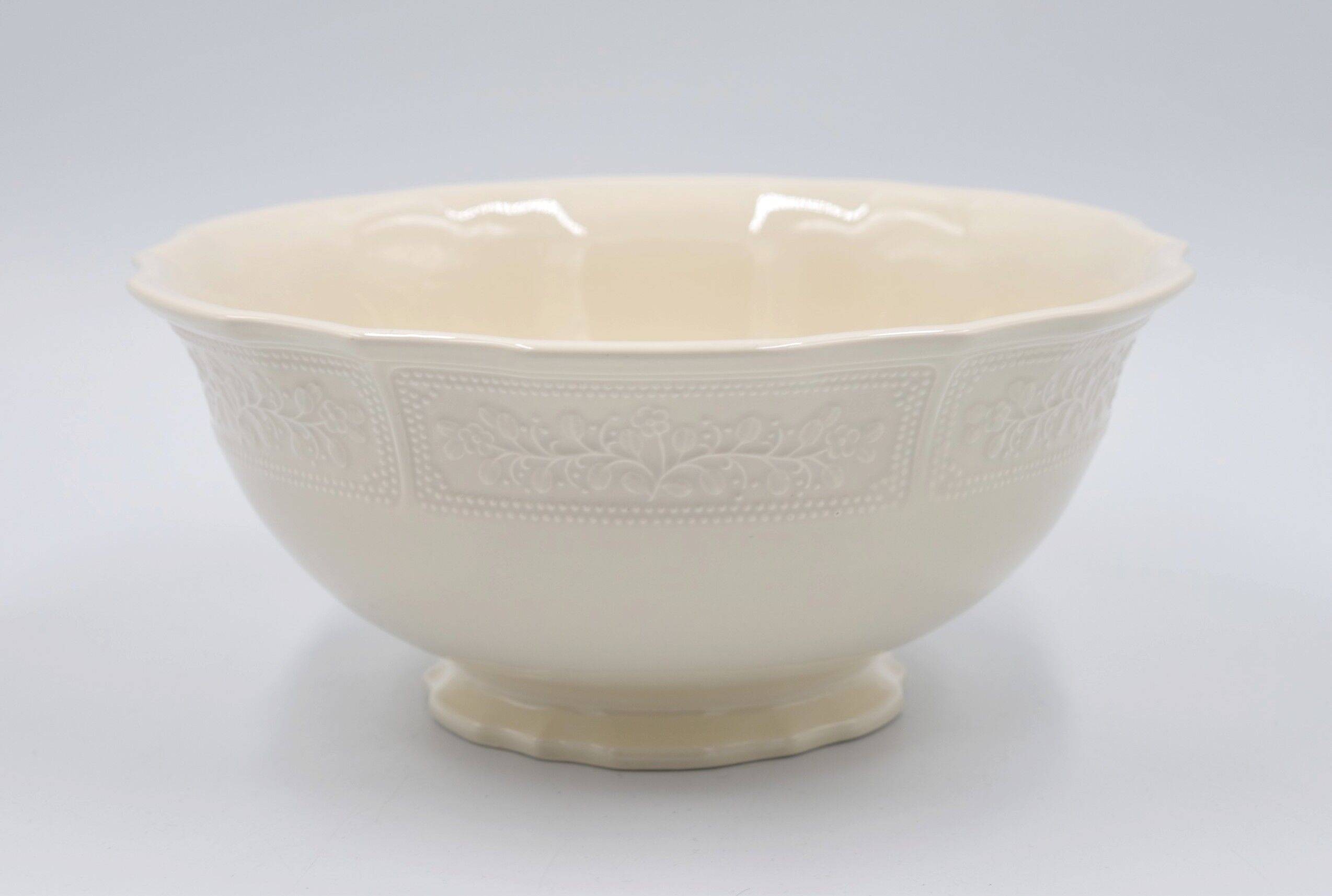 Salad bowl in off-white earthenware ivory Lunéville decoration in relief France