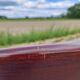 Chaise Baumann gondole en bois et cannage