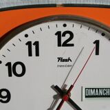 Vintage wall clock in orange formica