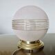 Plafonnier "globe" en verre granité rose,  liserés dorés, vers 1950 ou 1960