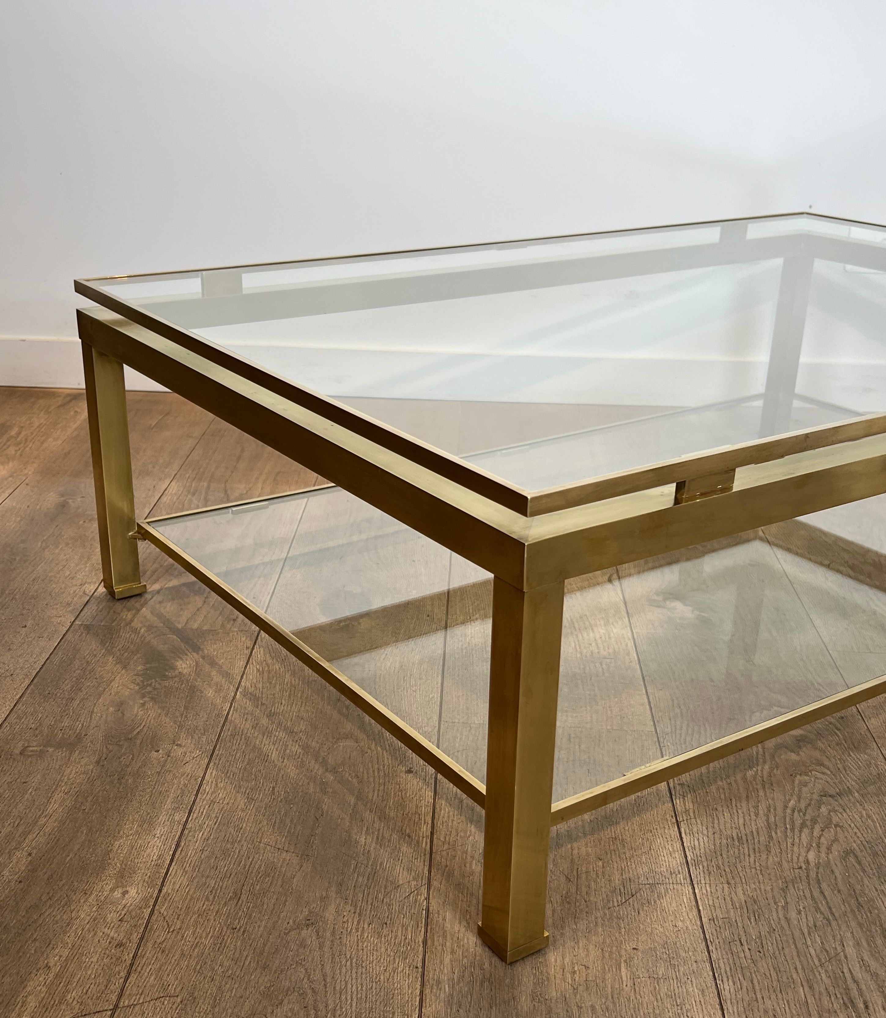 Modernist coffee table in brass and glass tops by Guy Lefèvre for Maison Jansen.