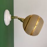 Vintage globe wall light in frosted yellow and gold glass.