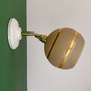 Vintage globe wall light in frosted yellow and gold glass.