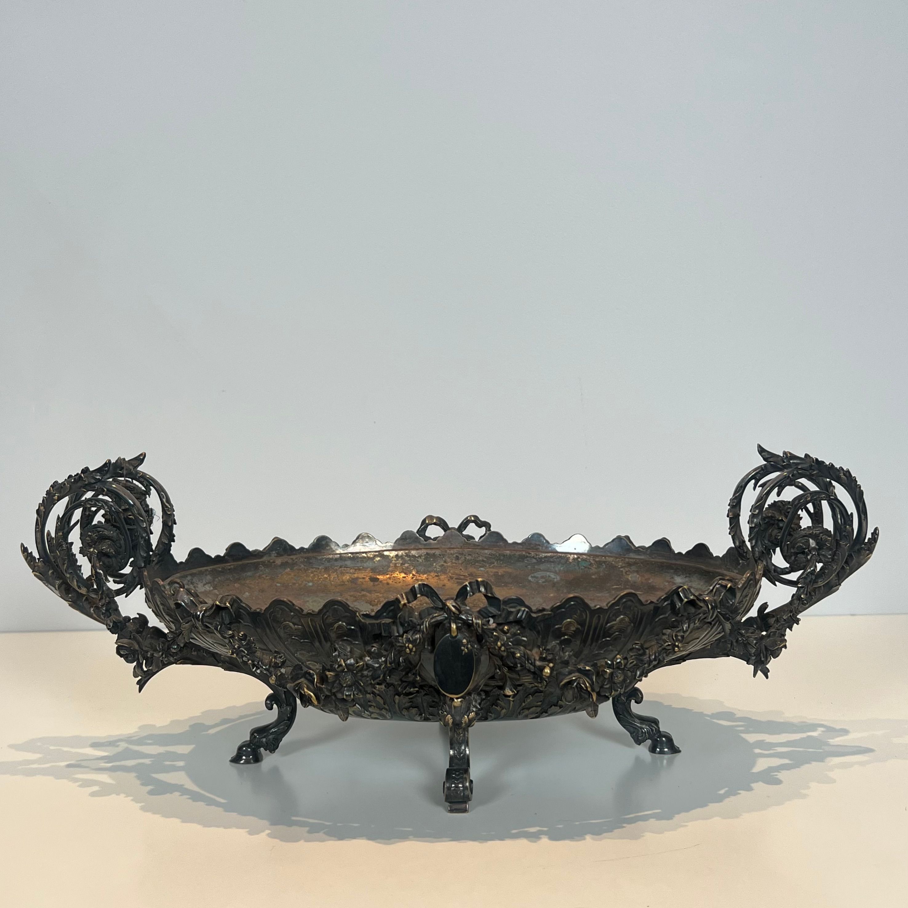 Especially a silver-plated metal table with engraving, signed.