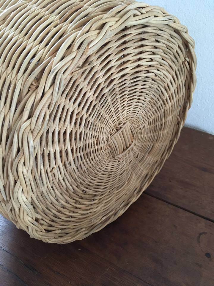 Round basket Wicker braided with two handles.