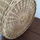 Round basket Wicker braided with two handles.