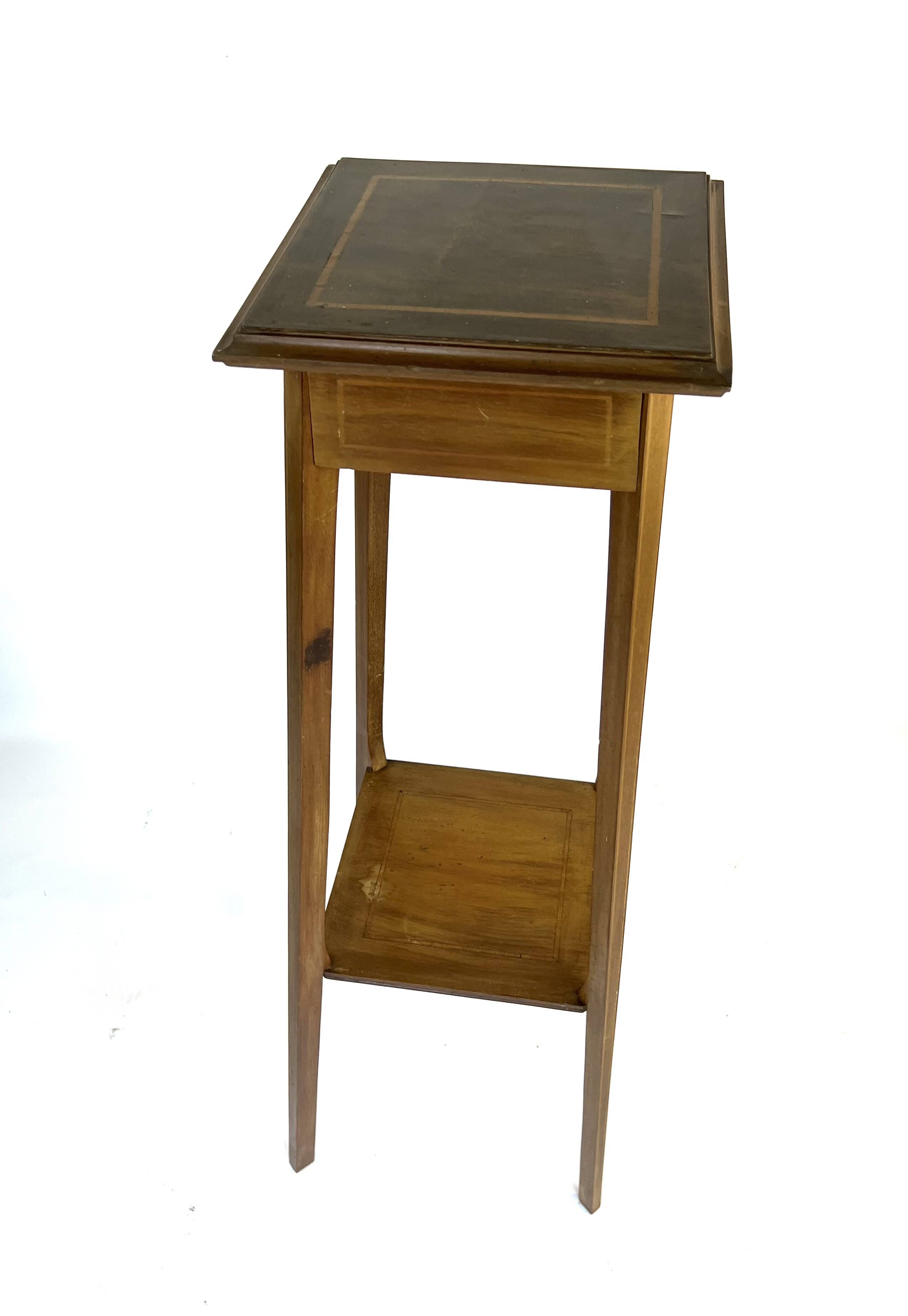 Large wooden pedestal table