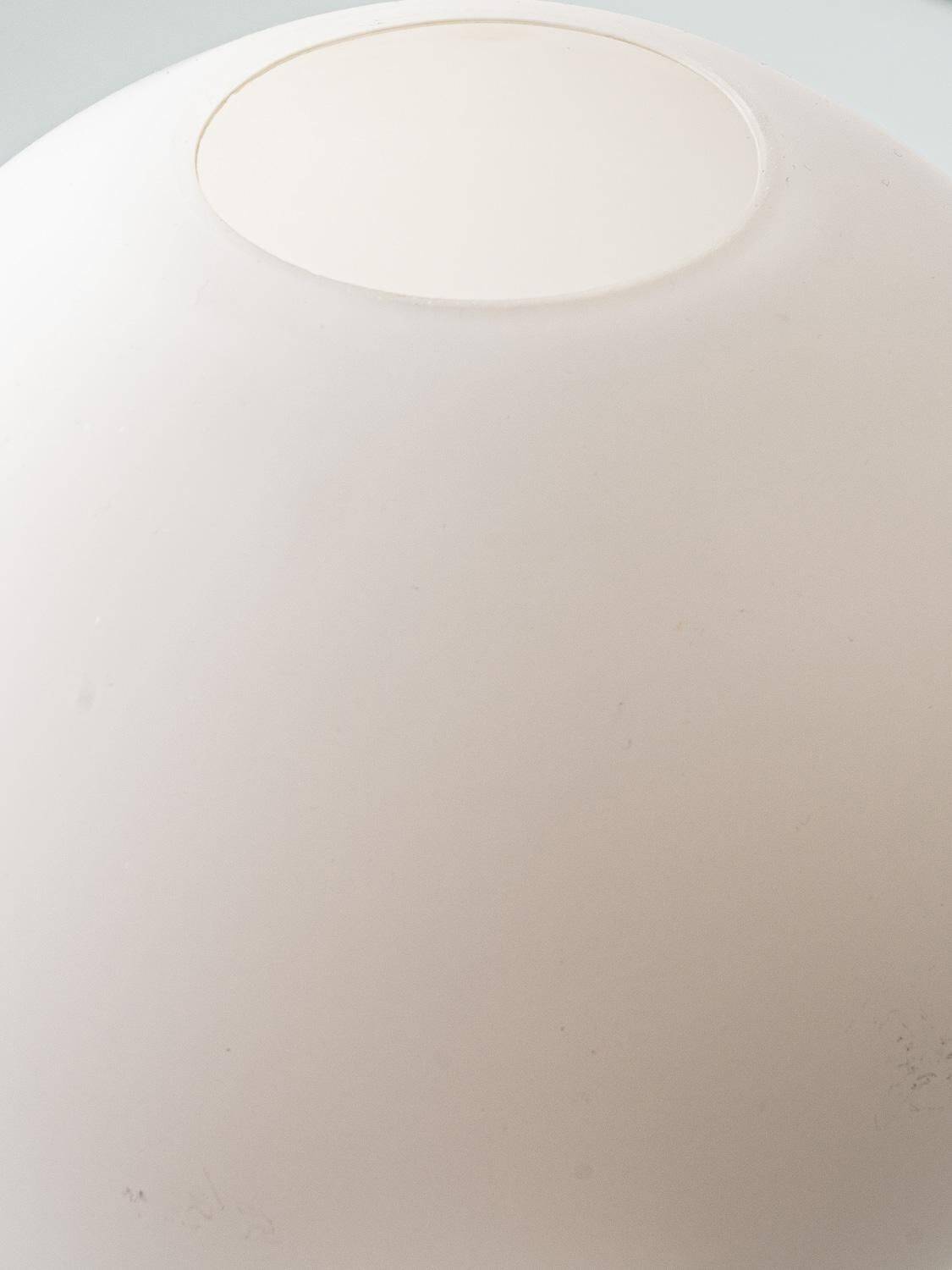 Mid-century modern table lamp by Jaap Ravelli, ceramic base and glass shade.