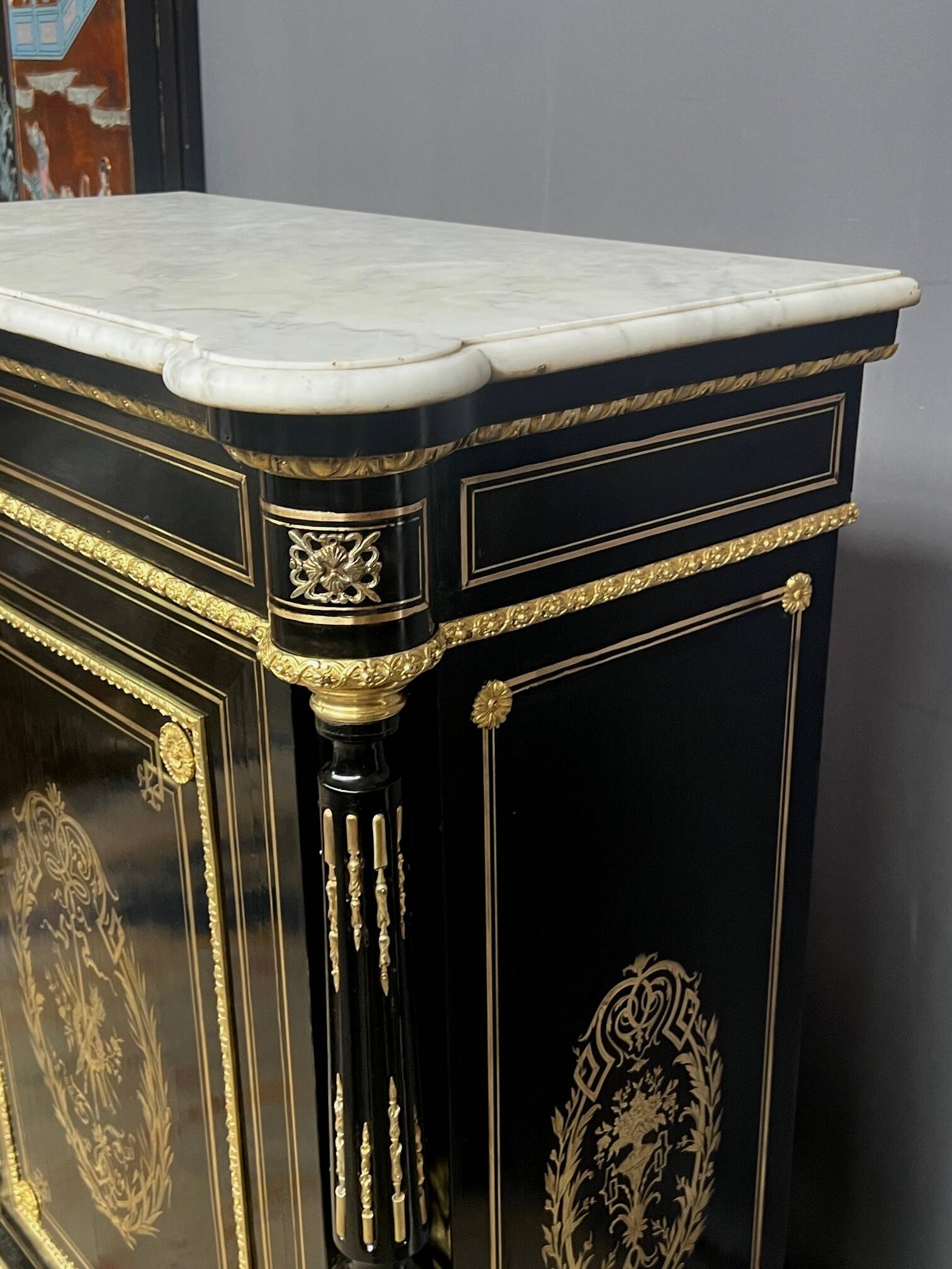 Napoleon III style commode, decorated with brass marquetry and gilded bronze mounts.