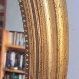 Miroir ancien en bois doré