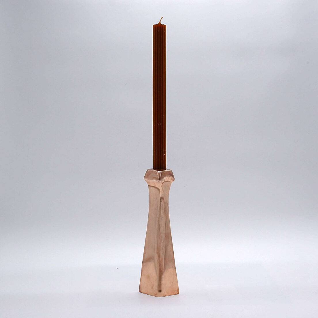 Sculptural copper candle holder