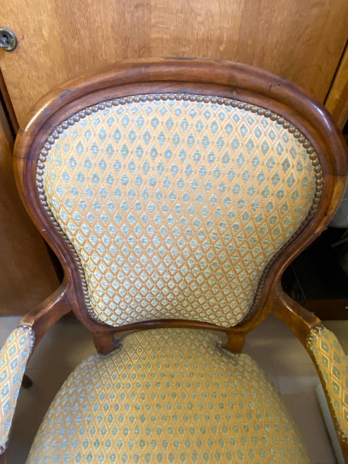 Two Louis XV style wooden and fabric armchairs