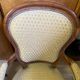 Two Louis XV style wooden and fabric armchairs