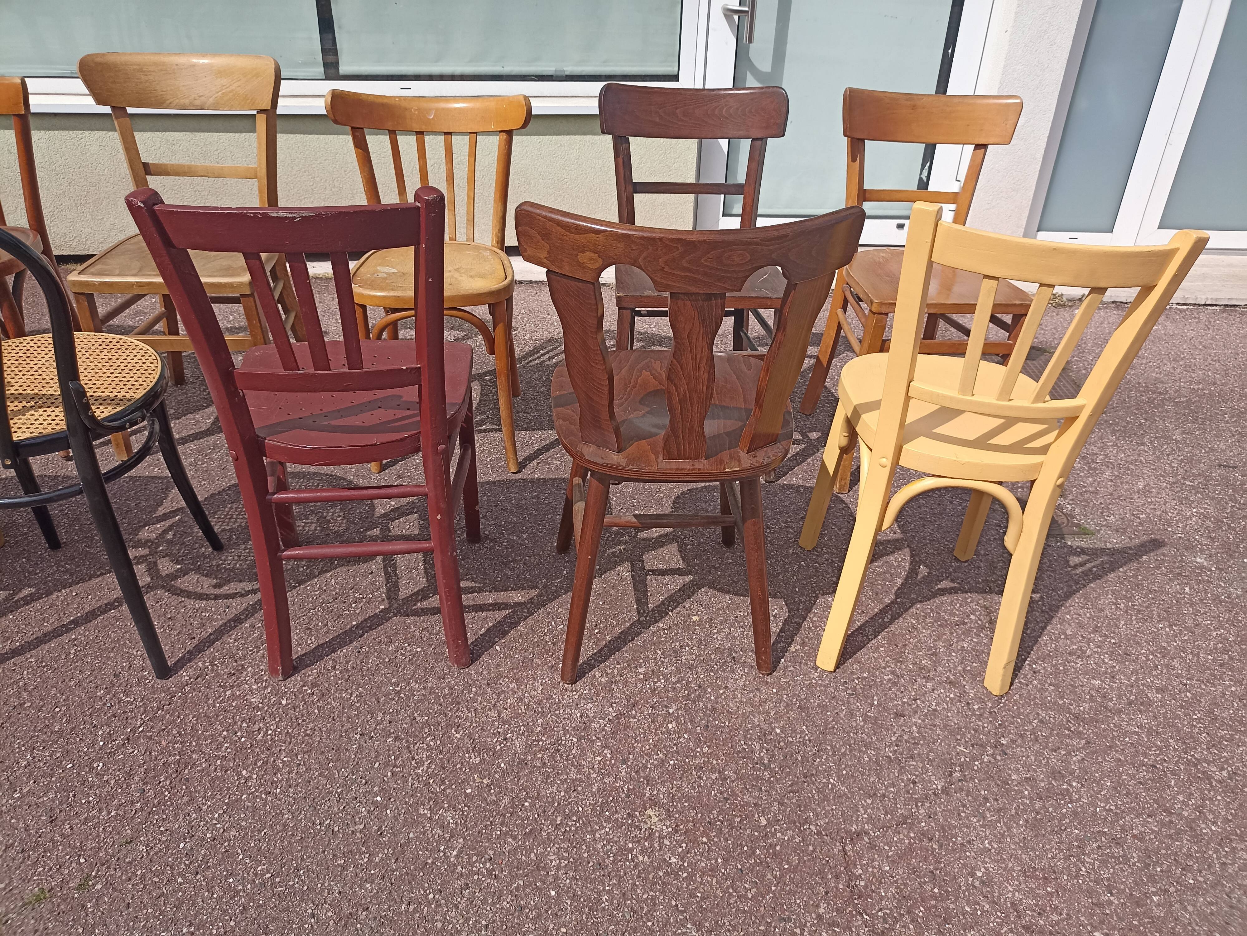Set of 12 mismatched wooden bistro chairs