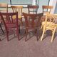 Set of 12 mismatched wooden bistro chairs