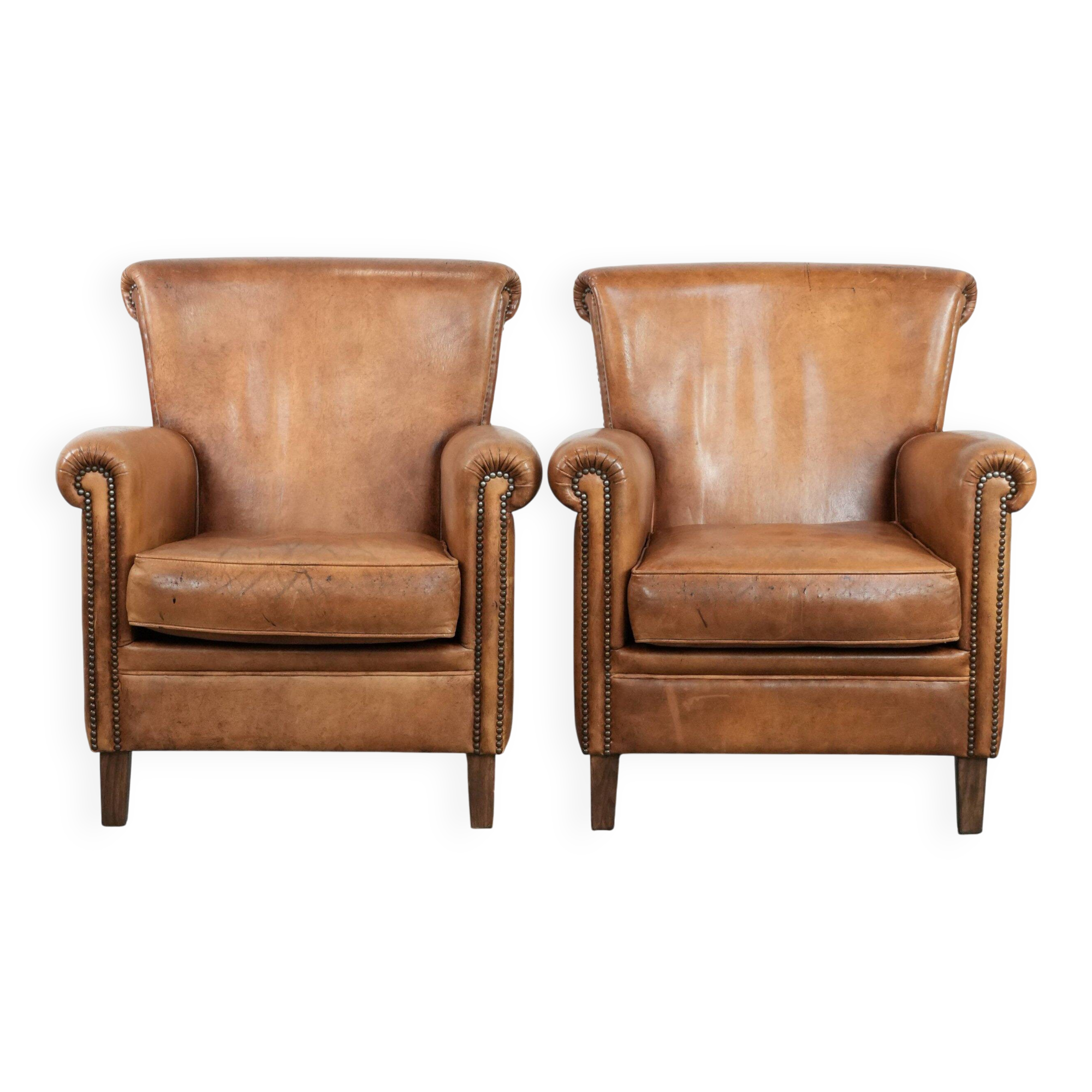 Set of two vintage sheepskin armchairs with beautiful and warm colours