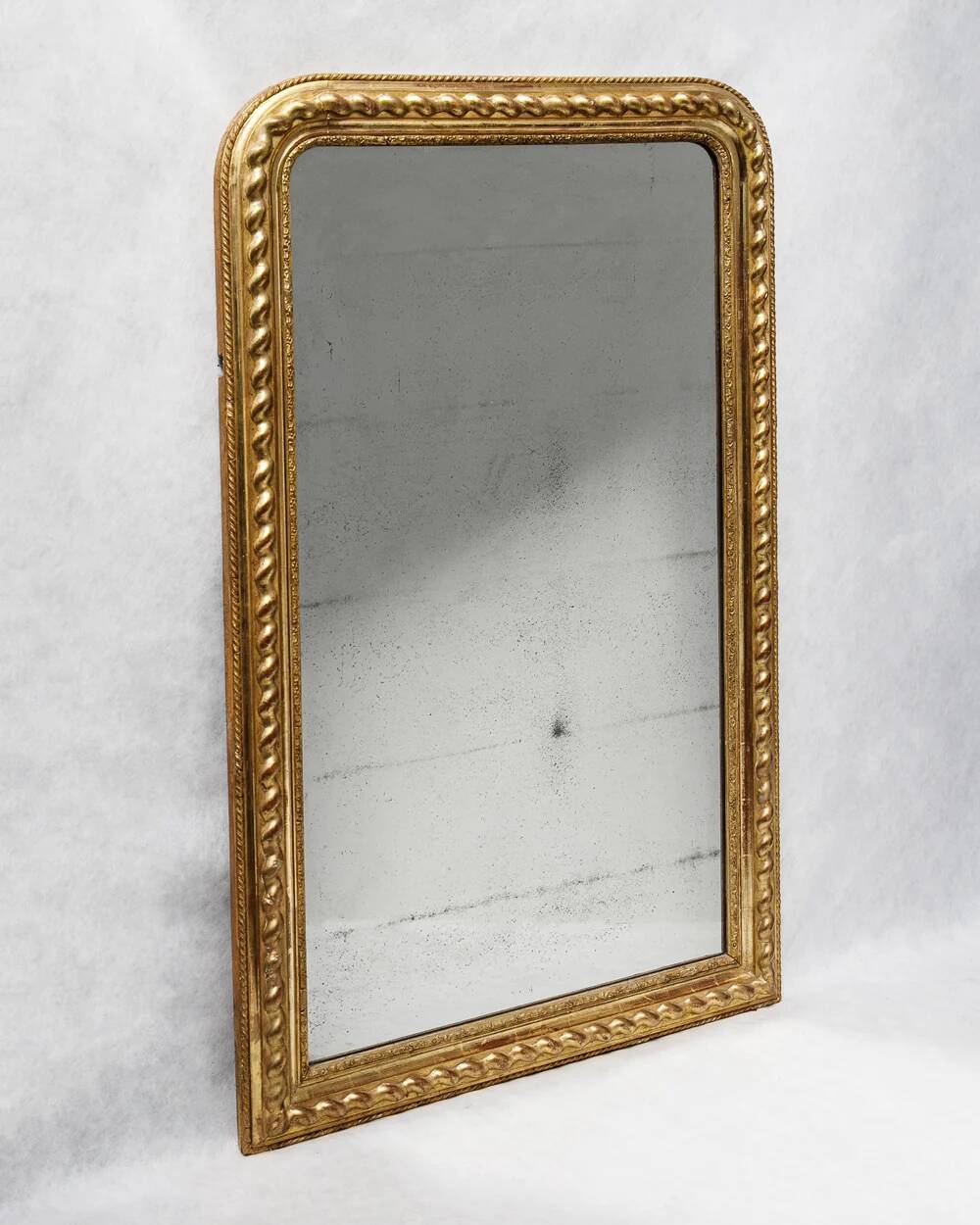 Louis-Philippe mirror with a geometric scalloped frame