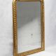 Louis-Philippe mirror with a geometric scalloped frame