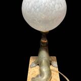 Lamp representing a seal on a marble base