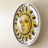 Decorative ceramic plate with sun face
