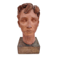 Tête de jeune homme sculptée en terre cuite