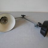 Super Chrome old articulated metal desk lamp on workshop decor base