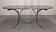 Chrome metal and smoked glass dining table, Italy circa 1970.