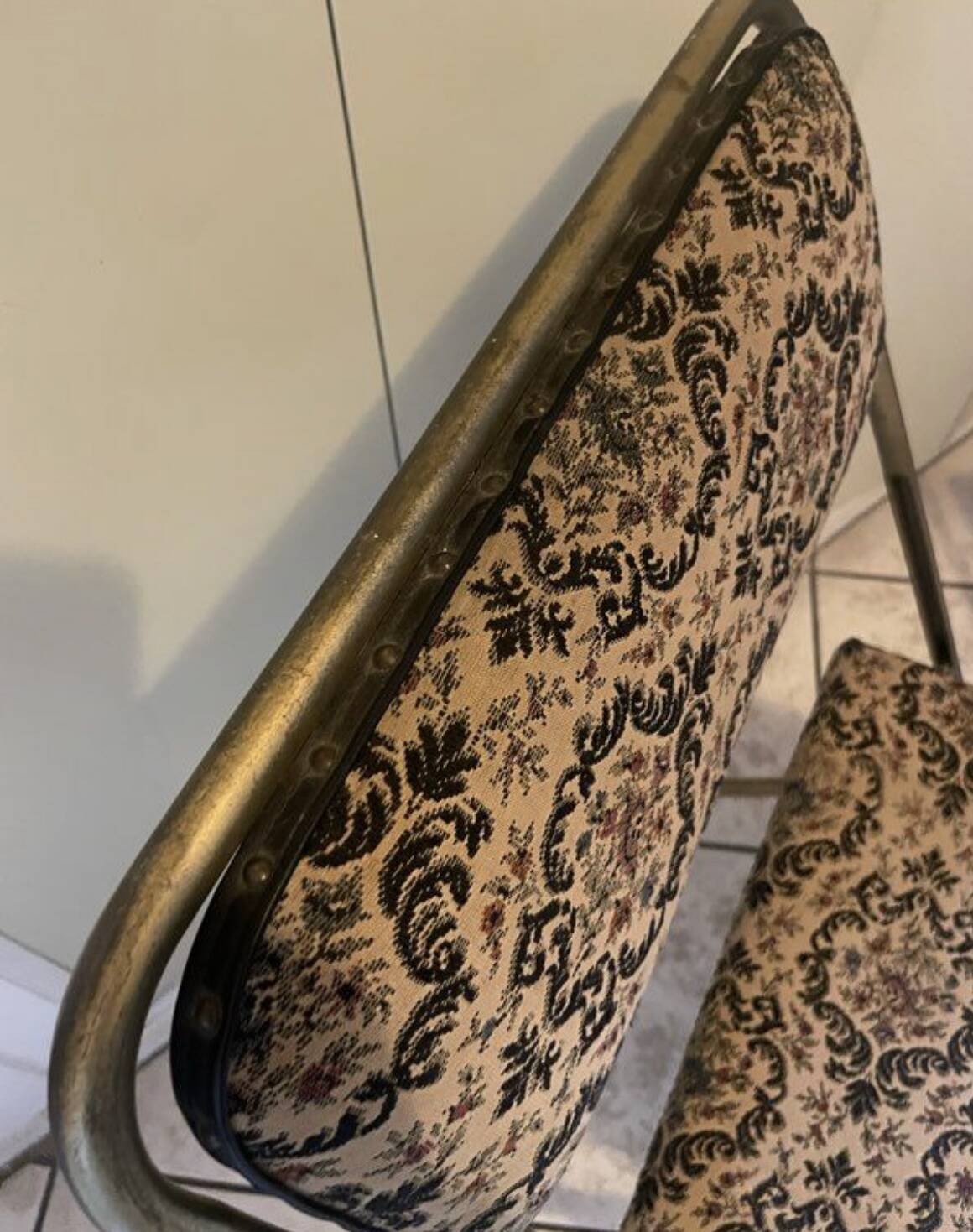Two antique Manufrance folding chairs in metal and fabric