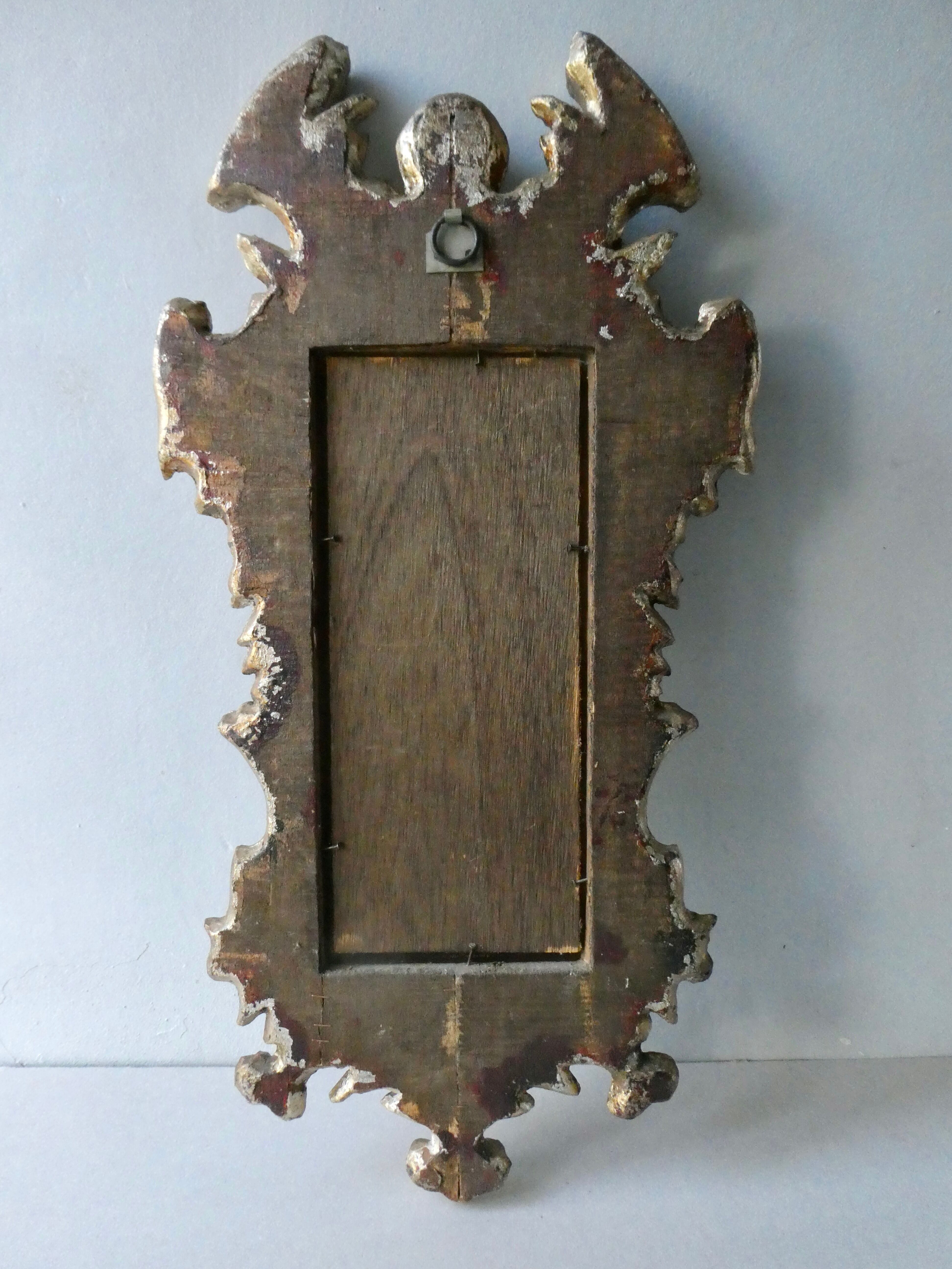 Mirror with cherub head in gilded wood, Venetian baroque style