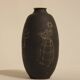 Ceramic vase decorated with women and a tree.