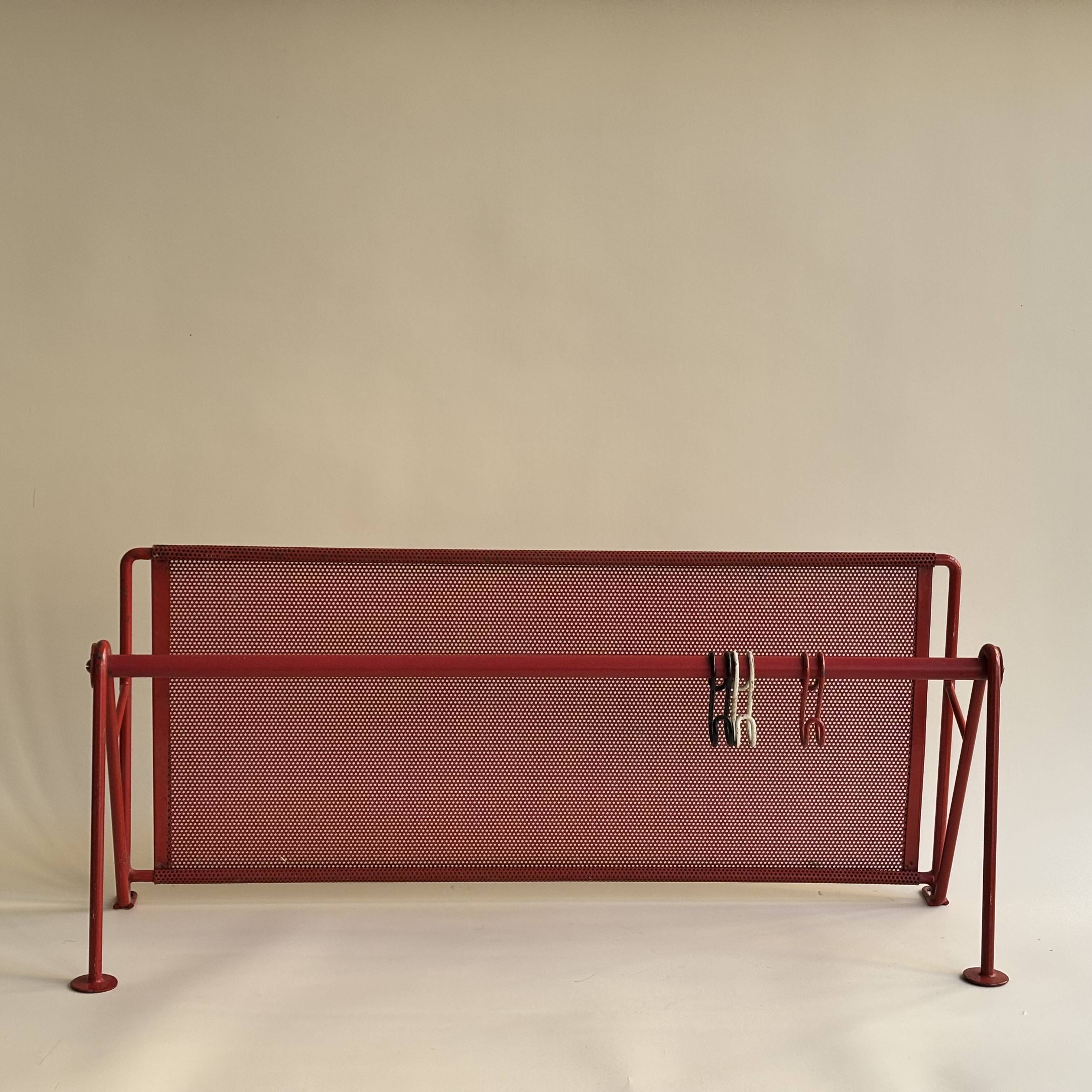 Vintage perforated red metal shelf